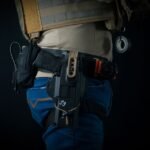 close up of personal defense gear worn on a belt including a holster