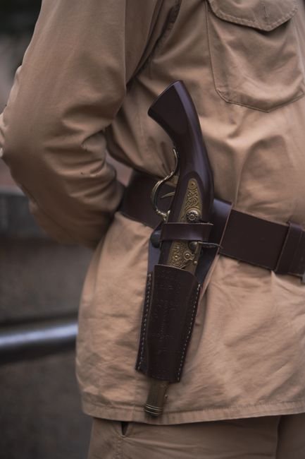 pexelsphoto10979293 edc deals close up of a pistol carried in a holster on a waist belt