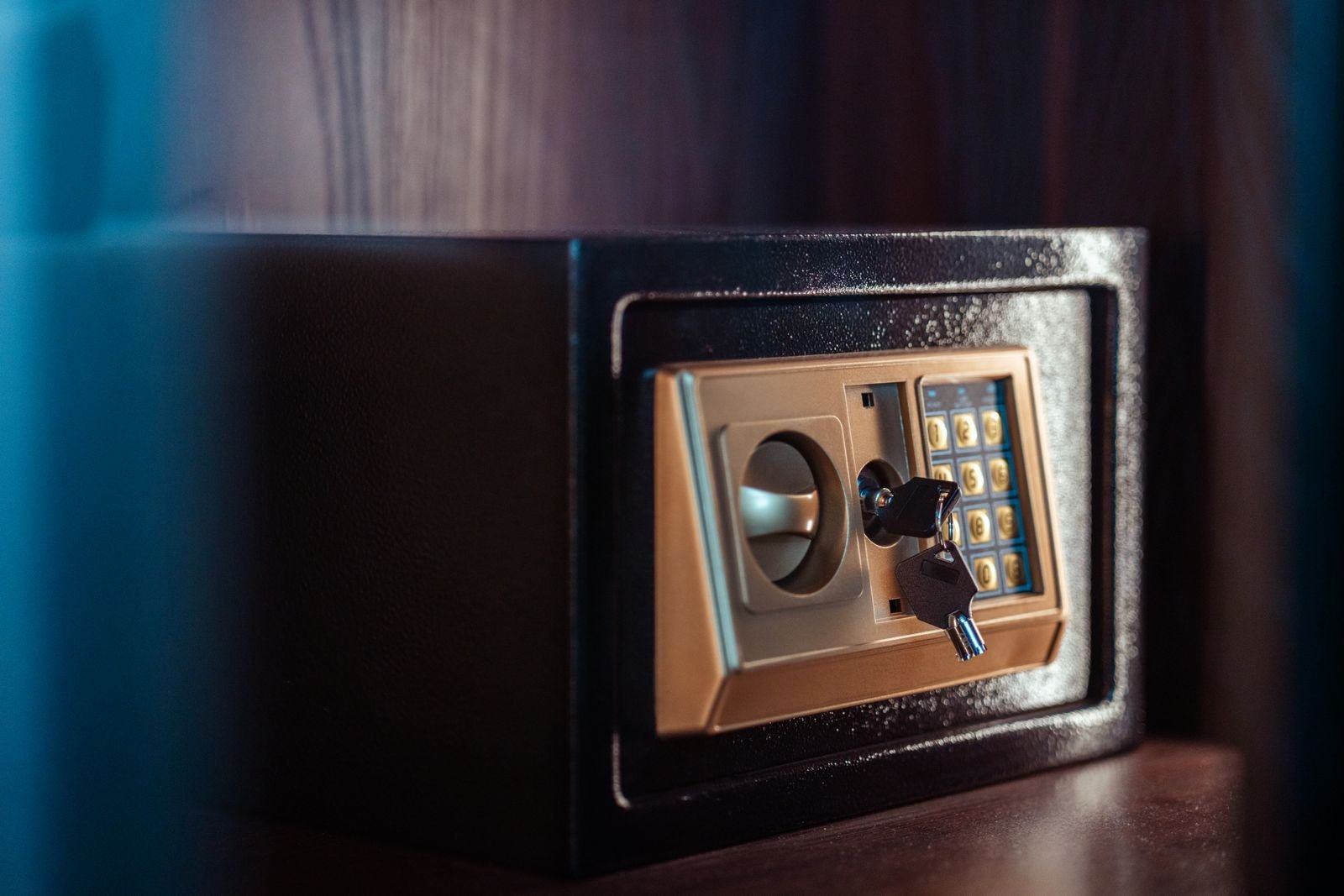 small home safe with an electronic keypad lock the type anchored down for secure firearm storage