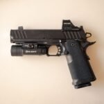 tactical handgun with mounted optic on a milled slide cut