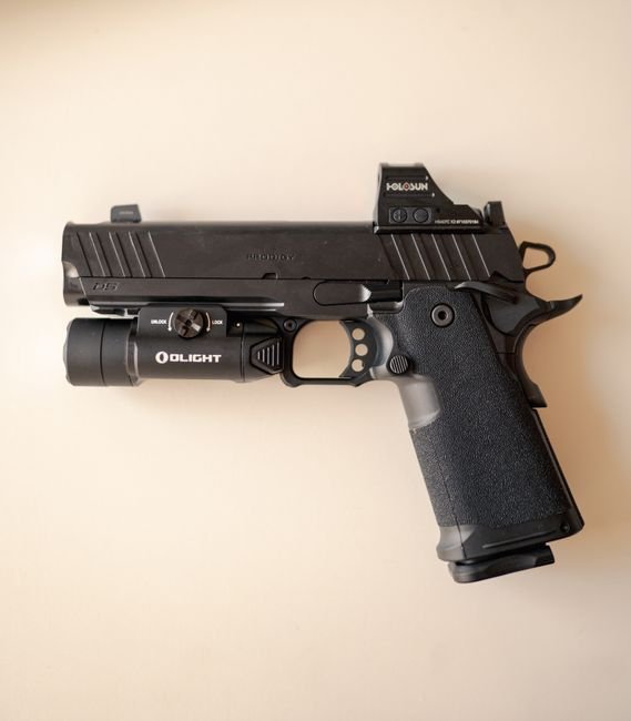 tactical handgun with mounted optic on a milled slide cut