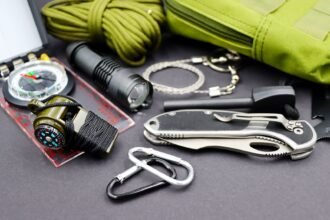 range and everyday carry gear laid out in an organised flat lay before packing a bag