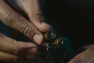 pexelsphoto6091657 edc deals hands loading cartridges into a pistol magazine after a range session