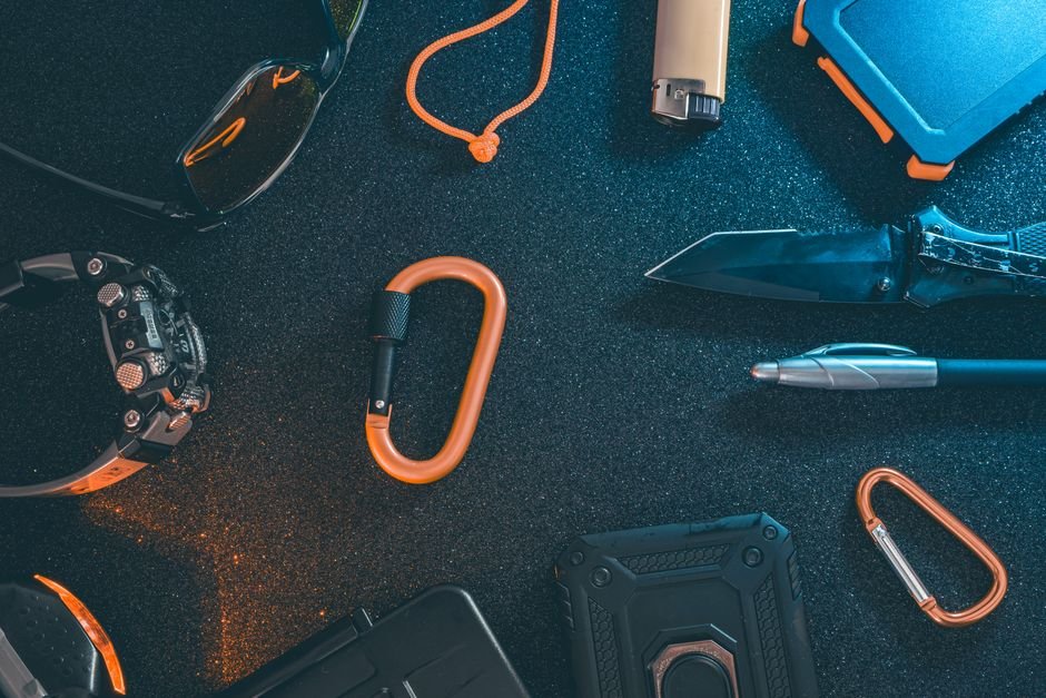 A curated selection of outdoor everyday carry gear laid out flat