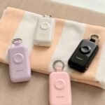personal safety alarms with keyring clips in pastel and black finishes