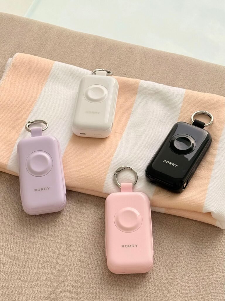 personal safety alarms with keyring clips in pastel and black finishes