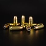 close up of brass and copper handgun cartridges side by side