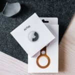 pexelsphoto7825627 edc deals apple airtag and leather key ring packaging on a wooden surface