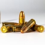 handgun cartridges arranged on a white background for comparison