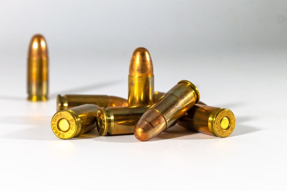 handgun cartridges arranged on a white background for comparison