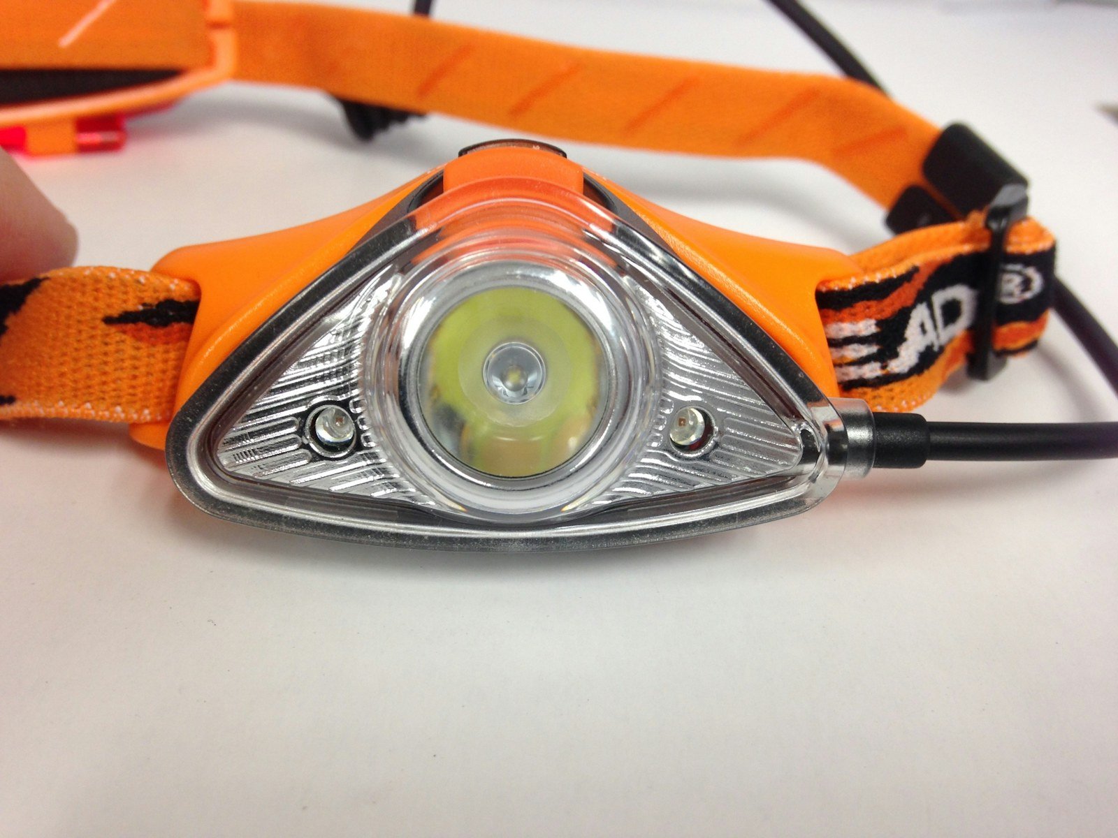 a headlamp with its battery compartment visible