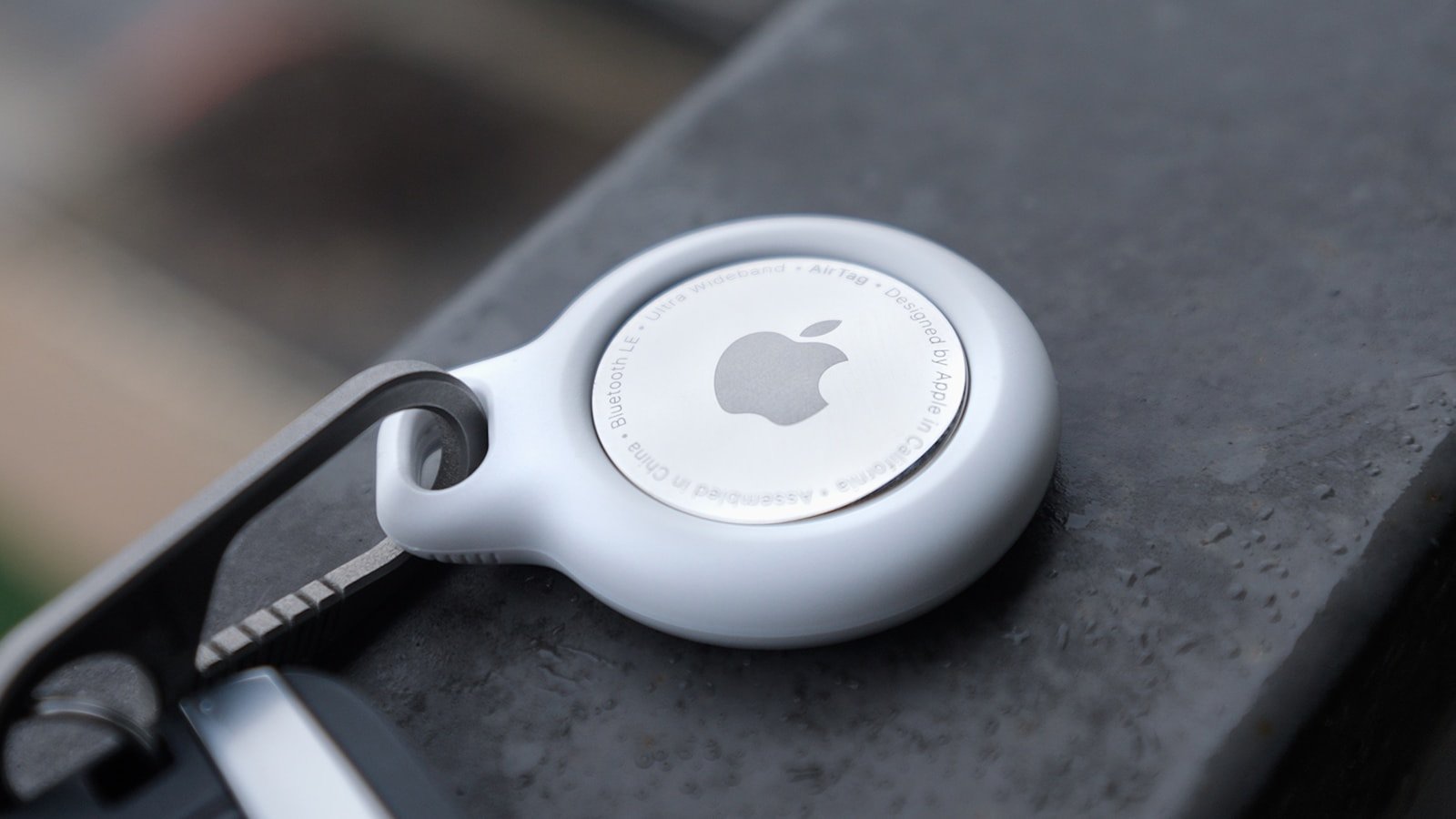 apple airtag attached to a keychain