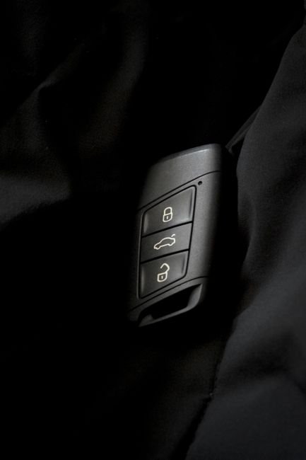 close up of a car key fob showing its lock and unlock buttons