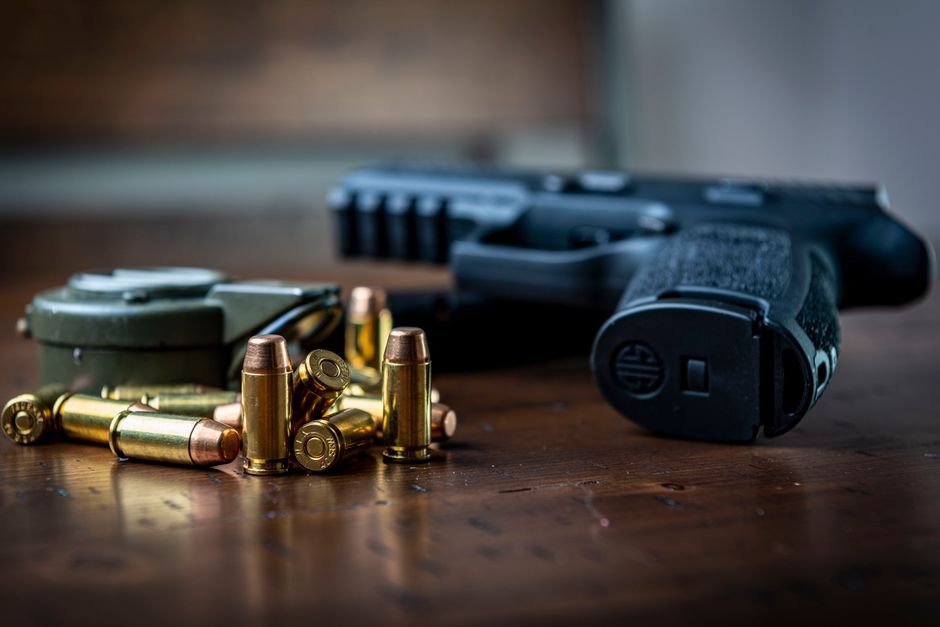 handgun with fmj and hollow point ammunition rounds