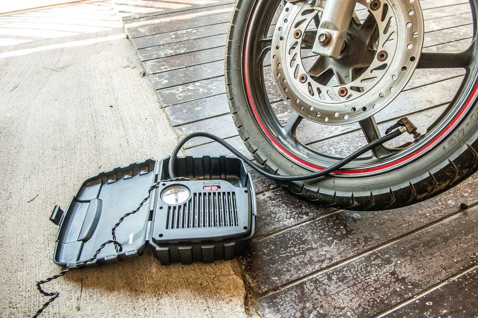 pexels12996982 edc deals a tire being inflated with a portable air pump