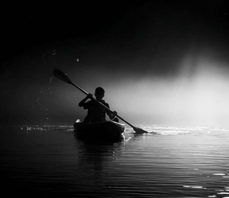 pexels13642193 edc deals a kayaker paddling through misty water at dawn the kind of low light conditions where a waterproof headlamp matters