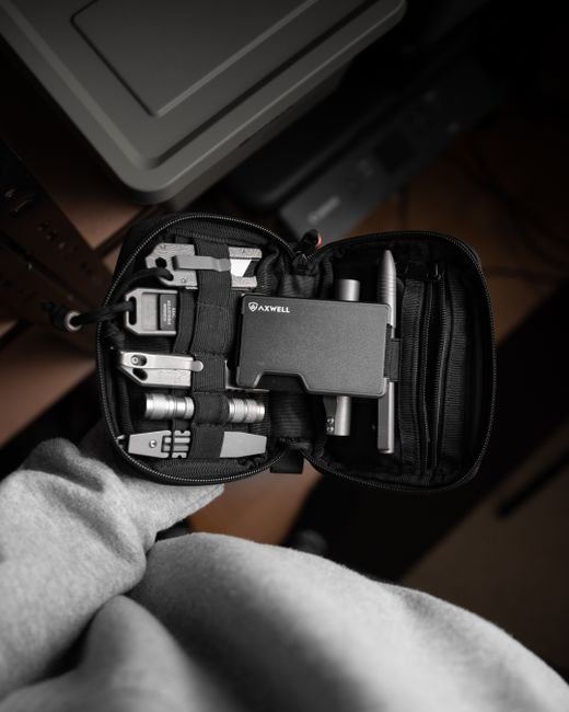a compact multi tool kit laid out for daily carry