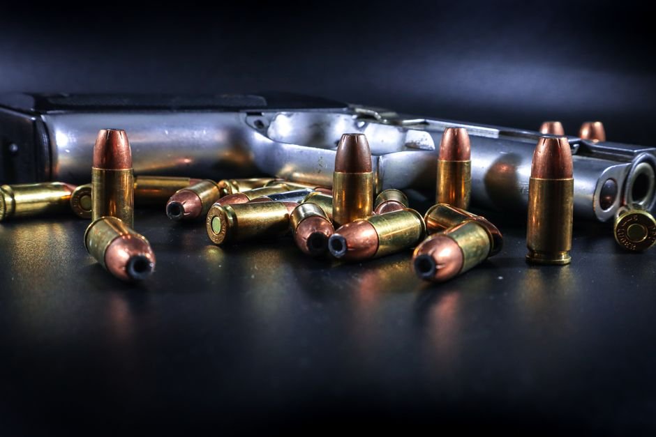 pistol with +p ammunition and scattered cartridges