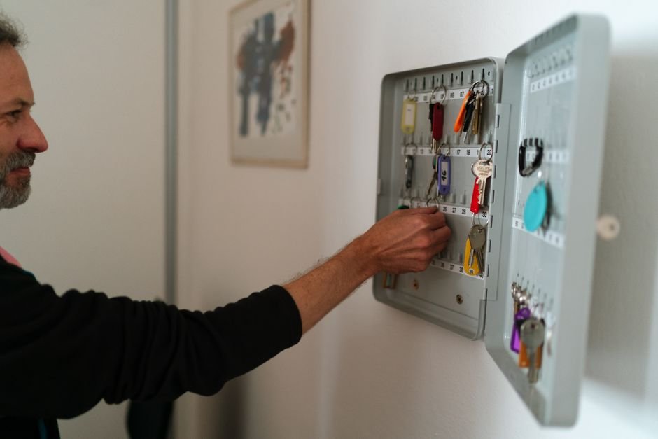 sorting bulky and odd shaped keys into a wall mounted key cabinet