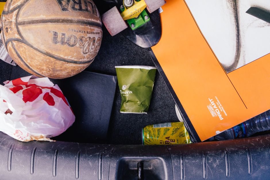 loose trash and clutter collected inside a car