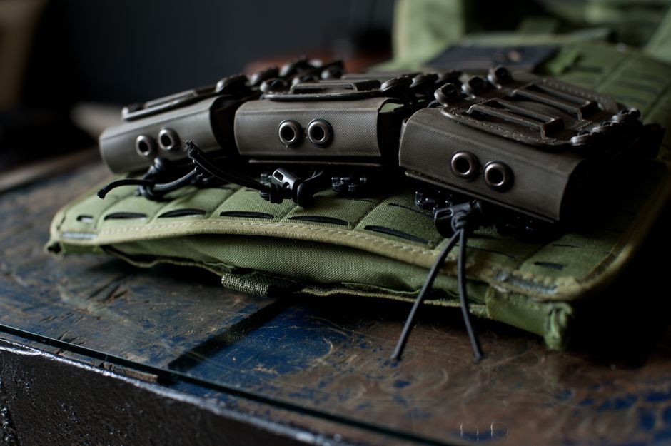 tactical molle pouches mounted on a vest
