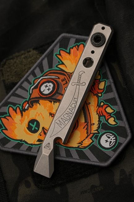 pexels33508961 edc deals a compact edc multitool resting on a patch showing a slim pocket ready profile