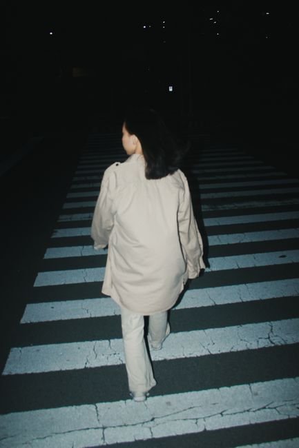 pexels5853301 edc deals woman walking alone at night on a city street