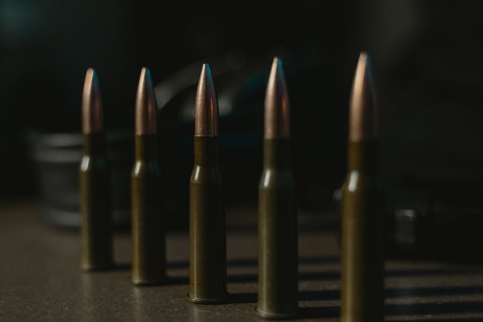 row of ammunition cartridges showing case and primer condition