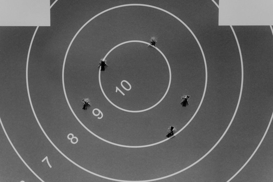 pexels6092073 edc deals shooting target with bullet holes showing group center