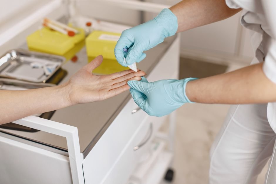 applying an adhesive bandage to a finger