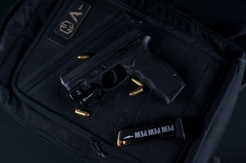 handgun and ammunition on a range bag