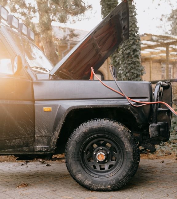 pexels6907042 edc deals an suv with hood open and jumper cables attached to the battery
