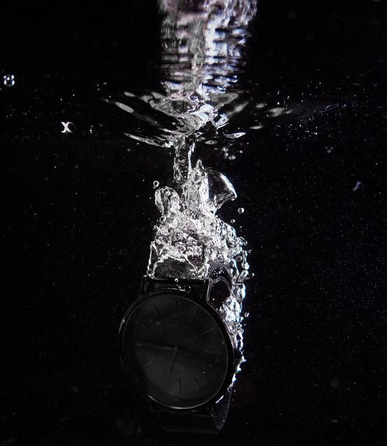 wristwatch splashed with water illustrating a water resistance pressure test