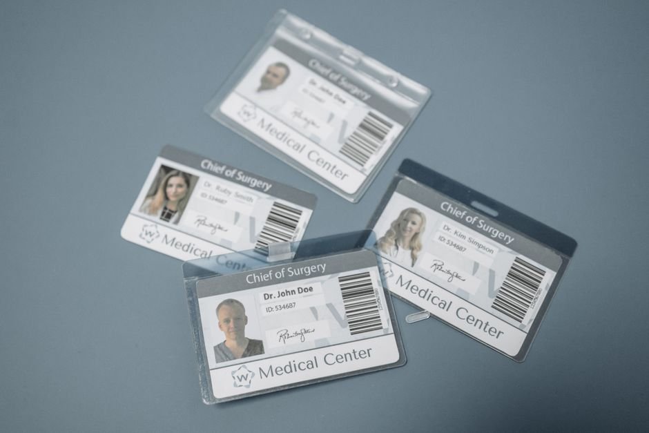 pexels7108127 edc deals id badges laid out on a surface