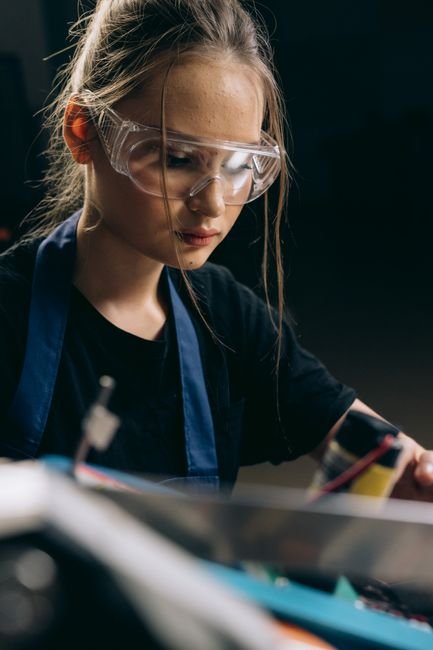 person wearing safety glasses over prescription eyewear