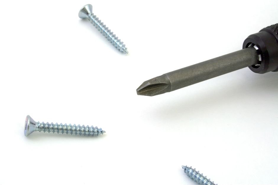 pexels93396 edc deals a small screw beside a precision screwdriver used for pivot screw repair