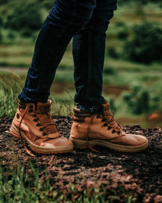 close up of hiking boots on a trail