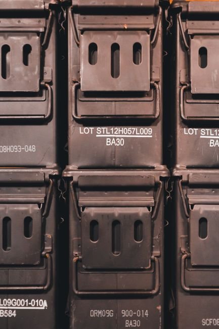 sealed metal ammunition storage containers stacked for long term storage