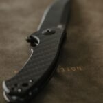 carbon fibre folding pocket knife on leather blade profile visible