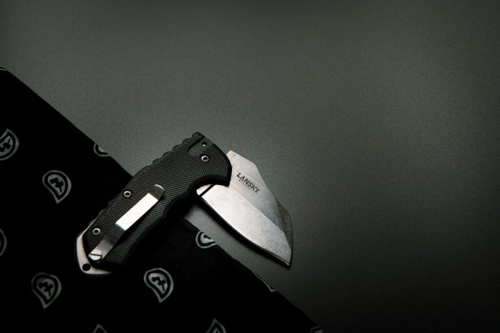 folding pocket knife on a dark surface the kind that corrodes on long trips