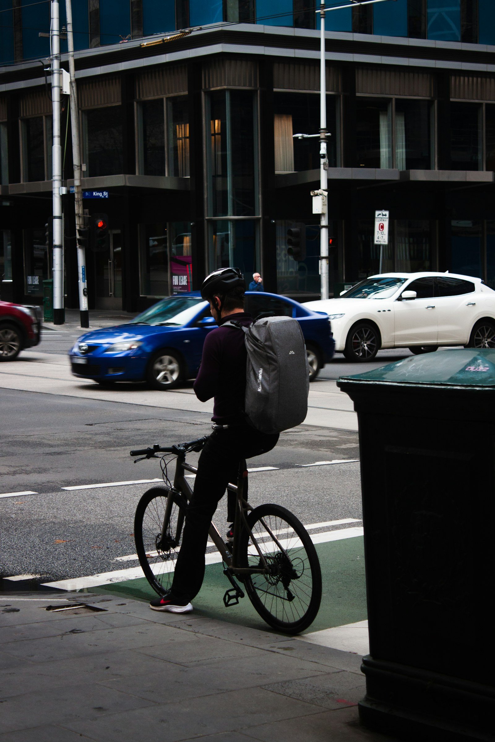 a person riding a bicycle on a city street